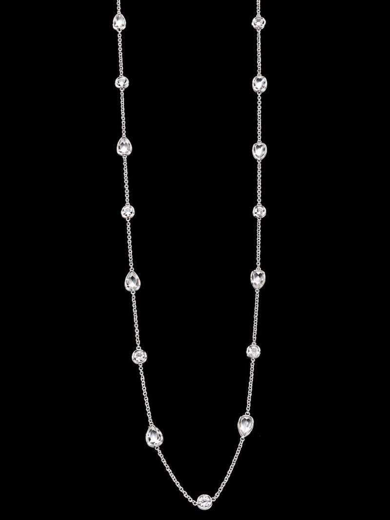 Pear shape rose cut diamonds bezel set with round brilliant cut diamonds bezel set in alternating sections. Approximately 23 inches. 18 karat white gold.