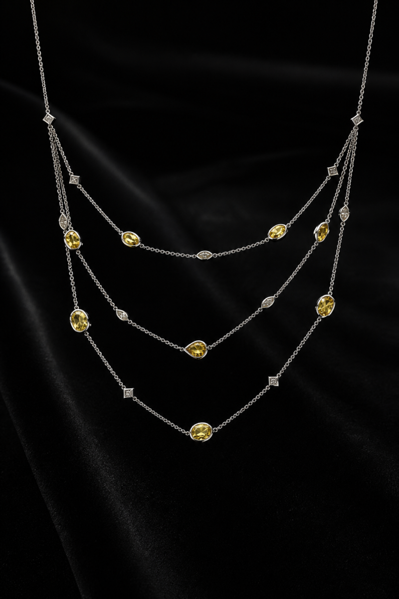 Yellow sapphire and white diamonds bezel set and layered in 18 karat white gold.